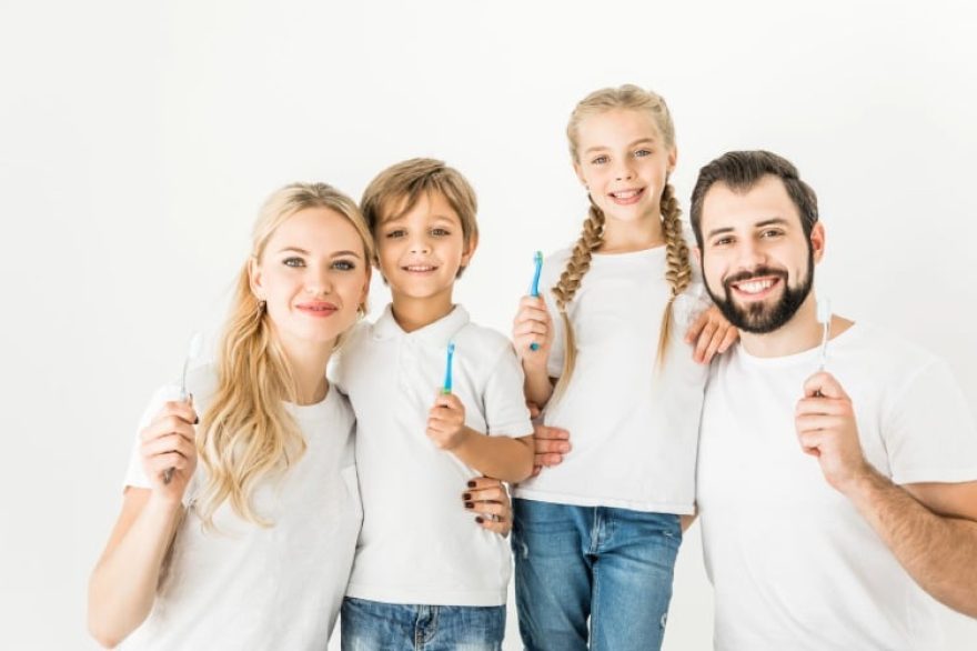 family with toothbrushes
